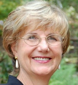 Professional headshot of licensed psychotherapist and spiritual counselor Benita Esposito, smiling warmly.